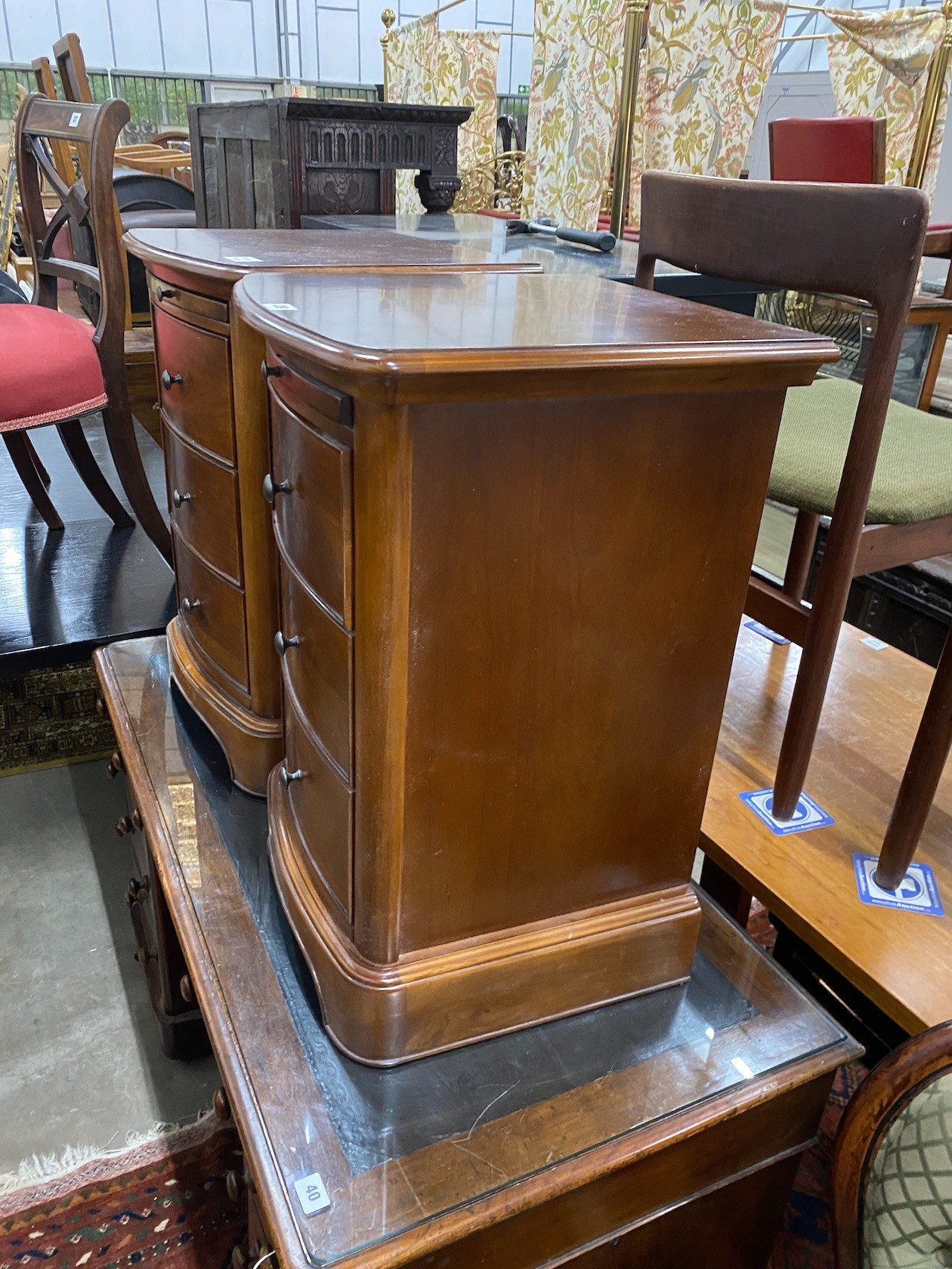 A pair of reproduction cherry three drawer bedside chests with slides, width 43cm, depth 42cm, height 68cm